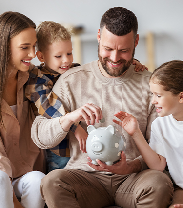 Happy family with piggy bank
